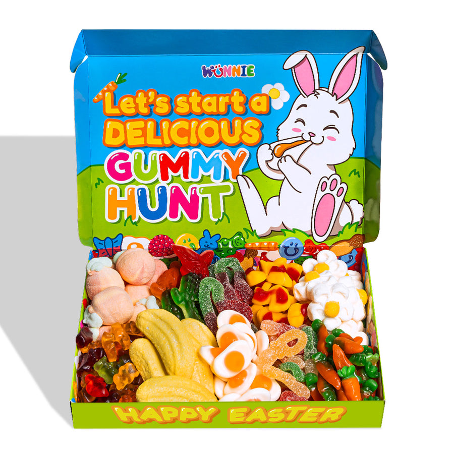 Scatola di caramelle gommose Wunnie box Easter, con coniglio in un prato e frase Let's start a delicious gummy hunt